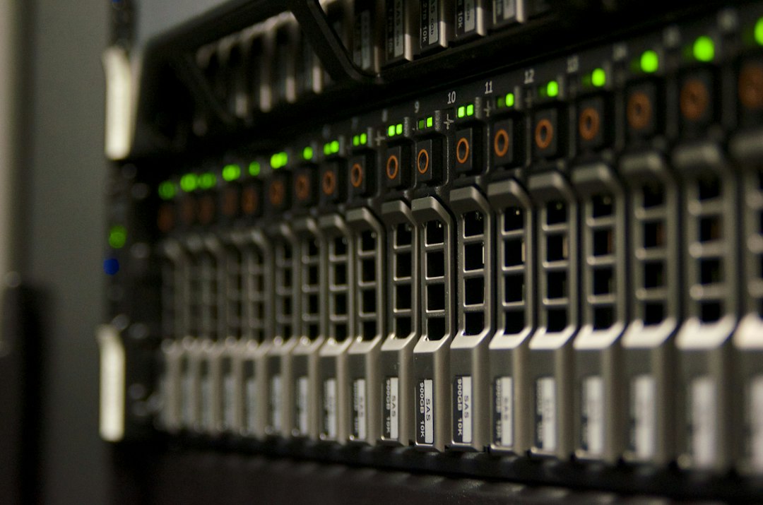 A close-up shot of a clean, organized server rack with glowing blue LED lights, representing a secure and solid digital infrastructure and foundation for a business.